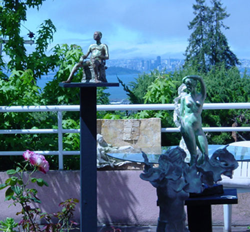 Photograph of several sculptures by the artist in an outdoor setting